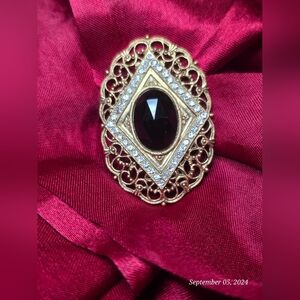 Victorian Style Filigree Brooch,  garnet color gem, vintage 1928 jewelry company